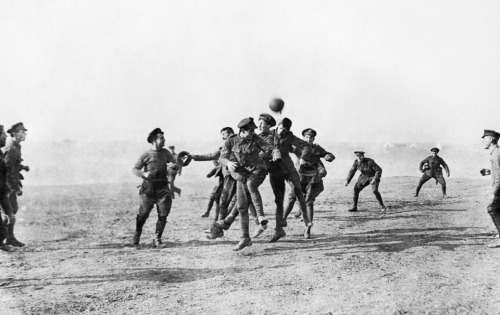 December 25, 1914. German and British soldiers celebrate Christmas together in no man’s land. This is a photo of them playing soccer. Check this blog!