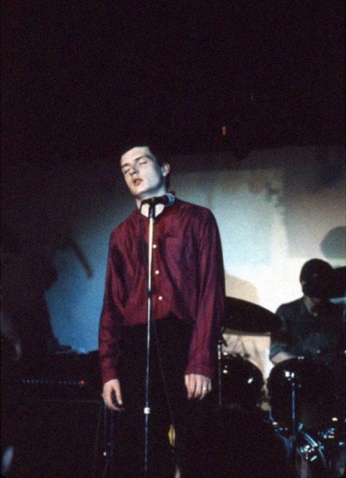 vaticanrust:Ian Curtis on stage with Joy Division at the...