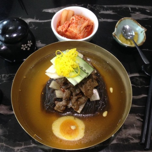 Pyongyang-style cold noodles with BBQ short-rib garnished on...