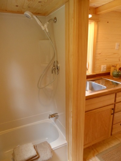 darlingamericancurl:<br /><br />For those in the Pacific North West, this is for you.  The Oregon Cottage Company has designed a jewel.  This 8’ 6” x 20’ is in my top 5 of the tiny house design.  This home has a full size bathtub, a closet for the washer/dryer (the only hidden washer space that I have come across), and a loft that comfortable sleeps four, or sleeps two with space for clothes storage.  This home can be built by the company for a mere $38,000 (the average home price in Oregon is $321,797) or the plans are available for free at the website.  <br />You can find out more information about the home here or you can download the basic plans here.  <br />