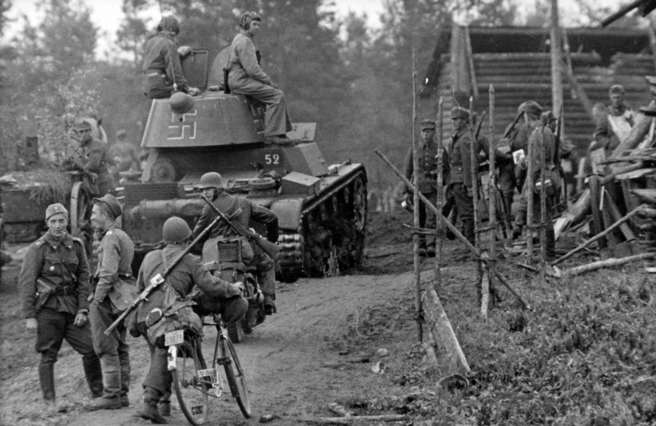 World War II • bmashina: Finnish troops with captured tank T-26...