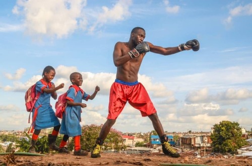 forafricans:Two young girls mimic a street boxer as he does...