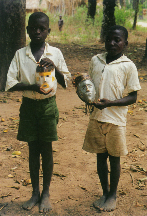 ukpuru:Boys with masks that they carved themselves. Akpa...