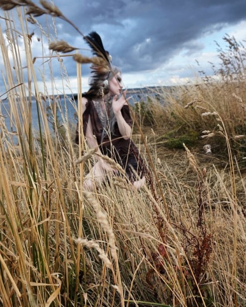 a sylph dissolving into the breeze on a clifftop