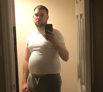 Fat man with beer belly Fat man with beer belly