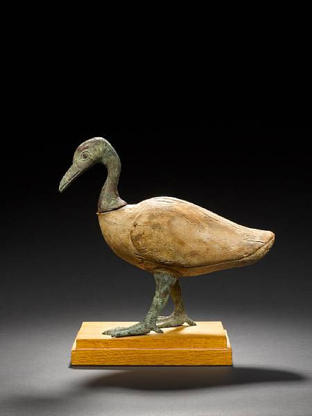 An Egyptian wood and bronze goose.Late Period, circa 664-32 B.C. © 2002-2010Bonhams 1793 Ltd.,