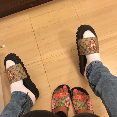 gucci flip flops on feet