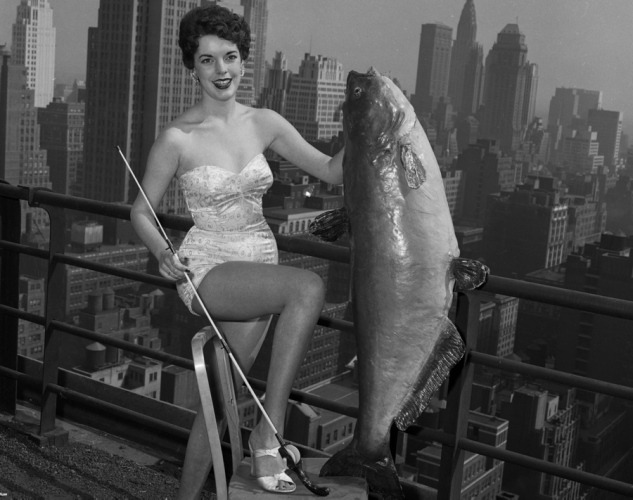 weirdvintage: â18-year-old Gail Hooper was crowned Miss National Catfish Queen 1954 holding a 56-pound catfish at the Hotel New Yorker (photo by Al Pucci, via) â