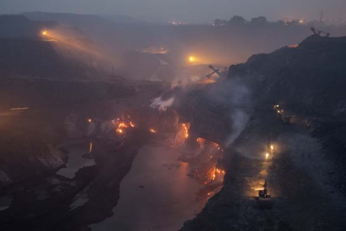 “THE EARTH IS ON FIRE”In Jharia, India, the...