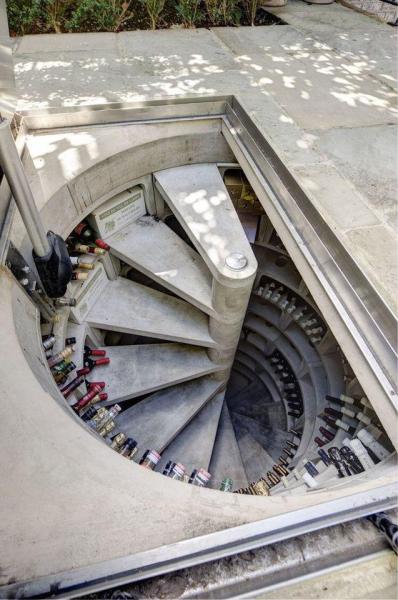 Outdoor cylindrical wine cellar with spiral staircase in Royal Crescent, Notting Hill [749x1128]