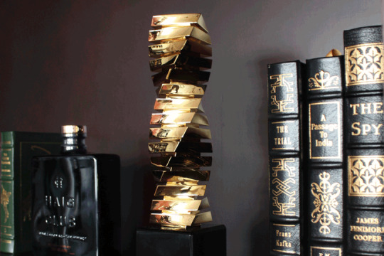 Close-up view of the Gold Twist award among books and whiskey in the Whiskey Library