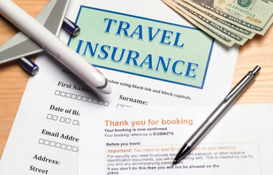 Travel insurance paper with money and pen