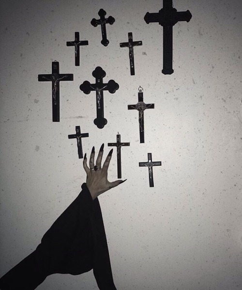 dark darkness goth gothic creature hand skin supernatural black white pale wall crosses