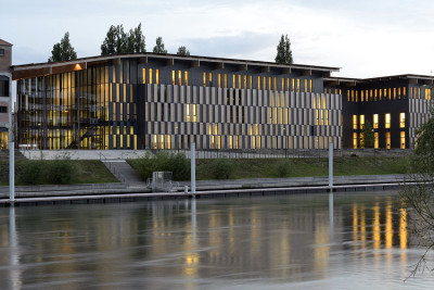 archatlas:<br /><br /><br /><br />Besançon Art Center and Cité de la Musique Kengo Kuma  Associates<br /><br />From the architect:Located in the eastern part of France, Besancon is also known as the city where Seiji Ozawa won the first prize at the International Competition of Orchestra Conductors (1959). Situated in the center of the city along the banks of the Doubs River, this multipurpose cultural facility is part of the FRAC project in France to stimulate cultural activity in regional areas, and features a music hall, contemporary art museum and conservatory (music school).The brick-clad warehouse that was built in the 1930s was converted into a museum. This structure, as well as the newly built music hall and conservatory are covered with a large green roof to tie them all together. Voids are provided between the respective boxes, and this space is covered by a green roof with a mosaic of plants and solar panels that allows soft light to come through.Images and text via <br /><br /> Kengo Kuma  Associates<br /><br />