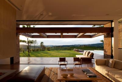 Living room can open its hinged wall to provide an unobstructed view of the lawn and pool in this house in Sao Paulo, Brazil. [4320 × 2880]