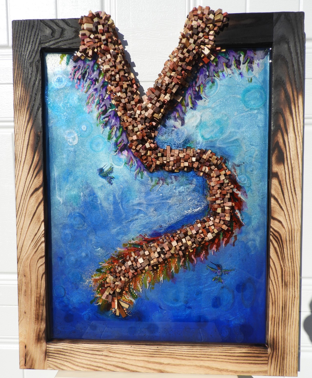 Healing This is a ash frame burned with over 25 different woods for the vine that’s healing it. Resin, paint, ink, pigments are use. Instagram: fusefuller https://www.fullercreations.net/