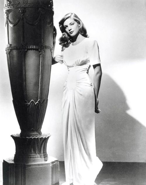 wehadfacesthen:Lauren Bacall, 1945, wearing a gown by Milo...