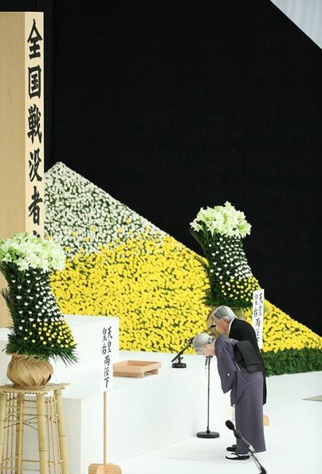 Emperor Hirohito in 1988 and Emperor Akihito and Empress Michiko...