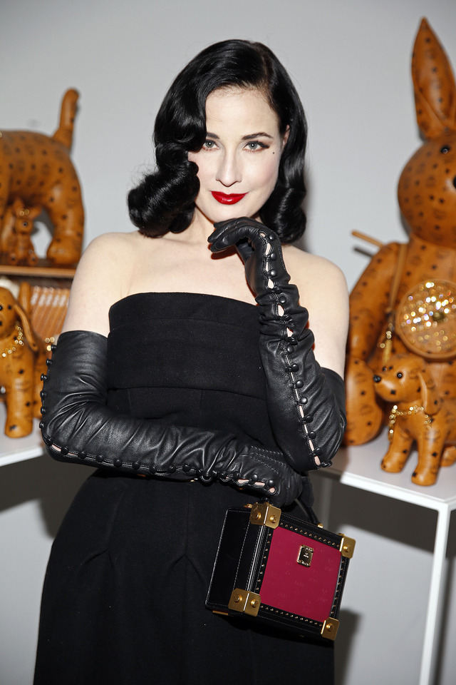 Celebrities in Gloves — Dita Von Teese wearing buttoned leather opera...