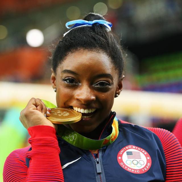 See the Whole Picture., Simone Biles poses after winning gold medal in...