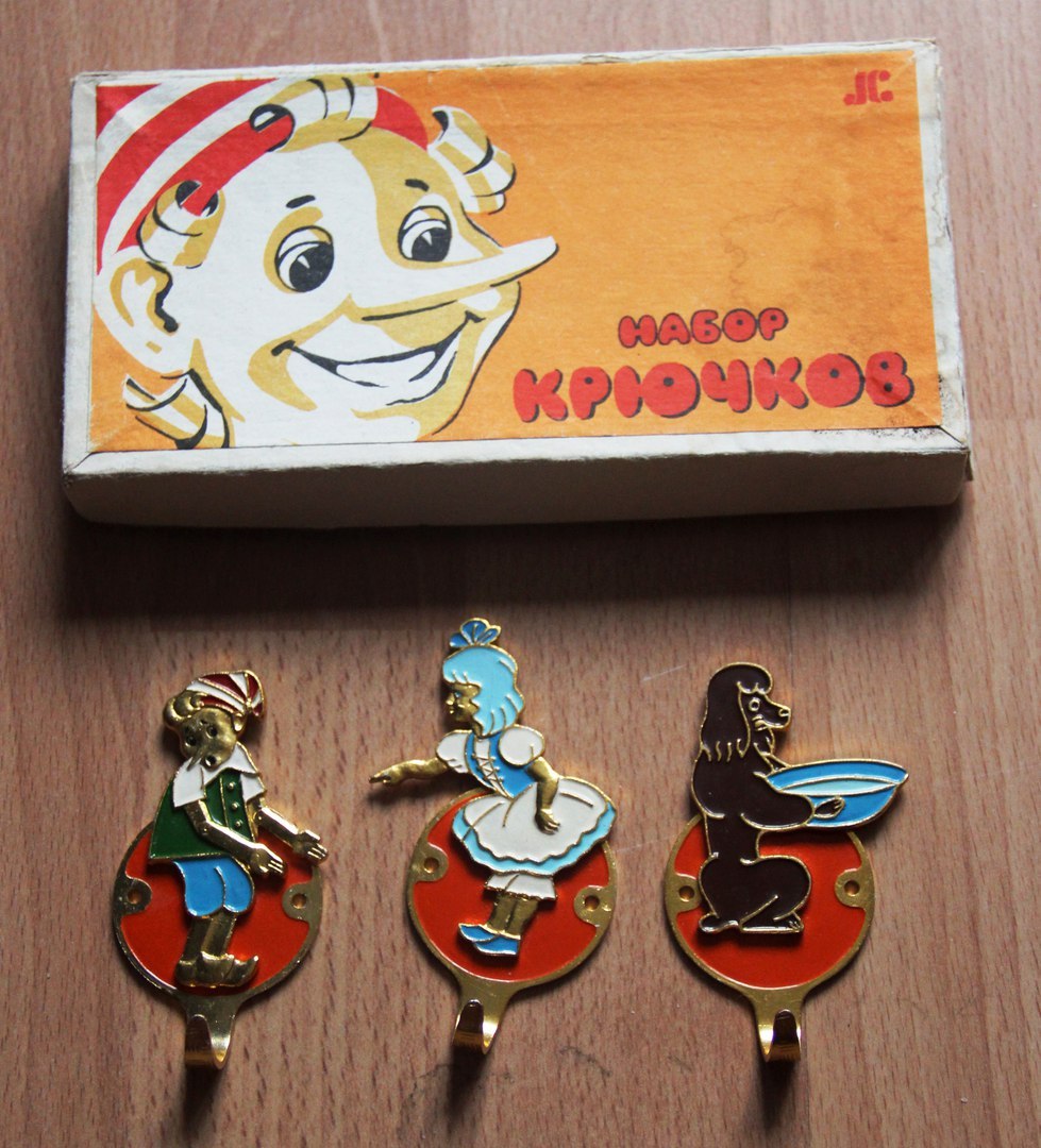 Wall hooks decorated with characters from Buratino (Russian book, cartoon, movie).
I had these very type of hooks at the back of my room’s door when I was little!