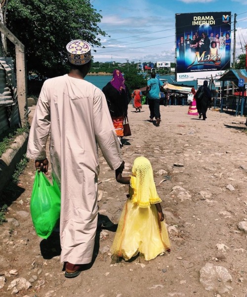 forafricans:A father and a daughter walk hand in hand towards...