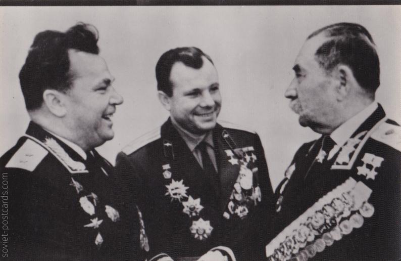 War hero I. Kozhedub and cosmonaut Yuri Gagarin congratulate S. Budyonny with his third Gold Star of Hero of the Soviet Union (postcard, 1982)