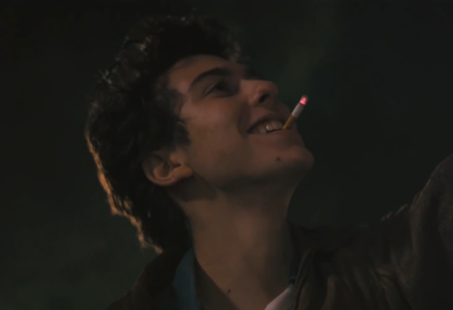 Nat Wolff smoking a cigarette (or weed)
