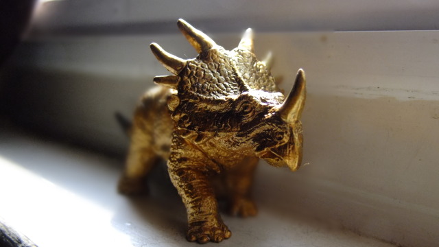 brass dinosaur figurine