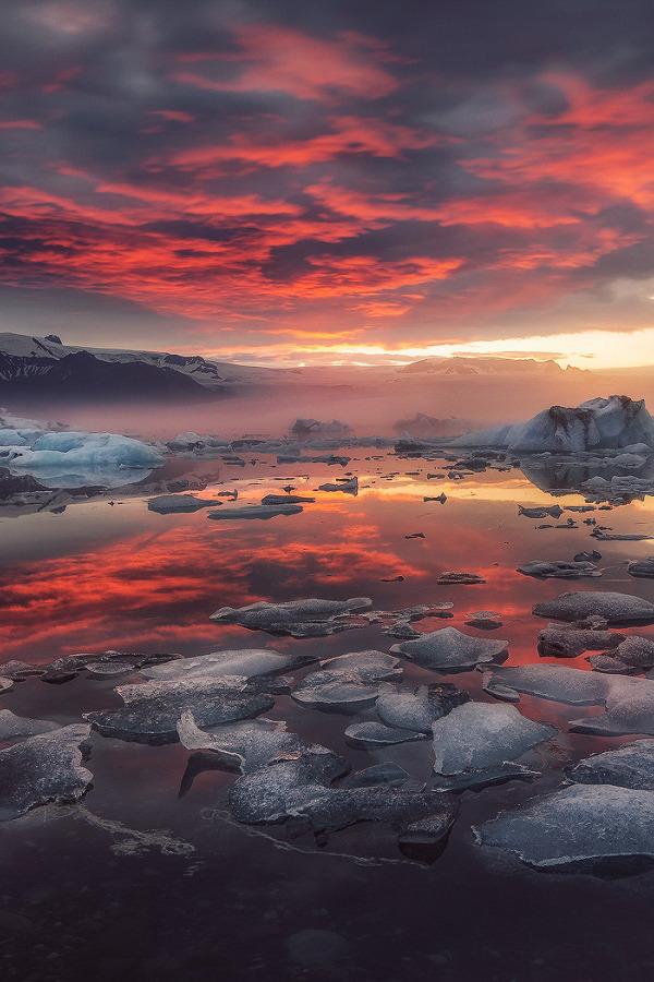 The Living... — Amazing sunset over foggy Glacier Lagoon in...