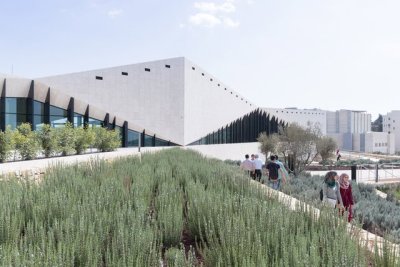 archatlas:<br />Palestinian Museum in Birzeit<br />The landscape of the Palestinian Museum by Heneghan Peng has the ‘worked’ quality of a city; every element of it has been touched and tells a story of intervention, production, culture, environment, commerce. Like a city, the terraced landscape has embedded within it its history. The approach to the Palestinian Museum is to draw on this history of the terraced landscape, embedding the museum into its immediate site and drawing from this site to tell a larger story of a diverse culture.<br />The cascade of terraces tells a diversity of stories, citrus brought in through trade routes, native aromatic herbs, a rich and varied landscape with connections east and west. The building itself emerges from the landscape to create a strong profile for the hilltop both integrated into the landscape yet creating an assertive form that has a distinctive identity.<br /><br /><br />Follow the Source Link for images sources and more information. <br /><br /><br />