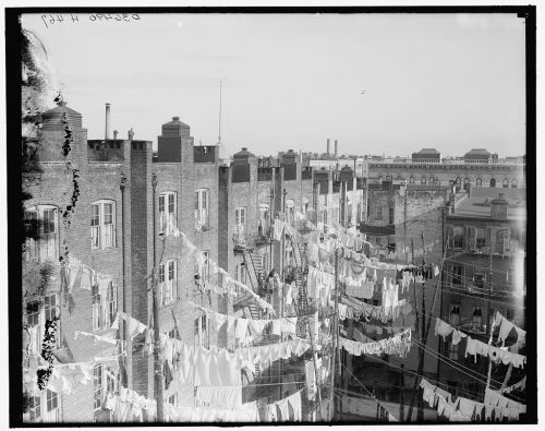 onceuponatown:New York City: Tenement yard with clotheslines....