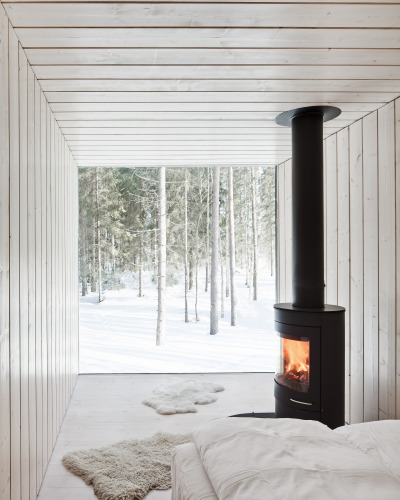 Serene sitting area has an unobstructed view of the surrounding forest in this home in Pirkanmaa, Finland [2500 × 3125]