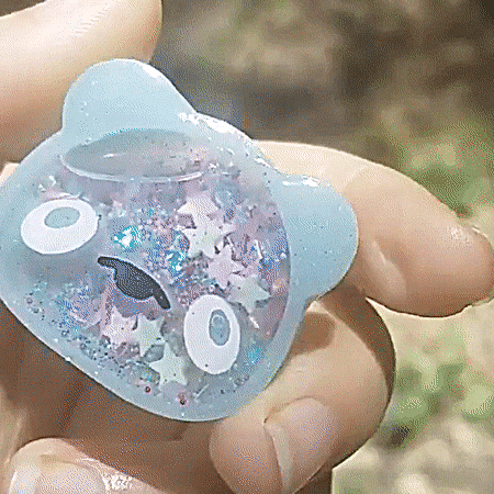 my gifs resin resin art stim resin shaker bears fake animals pastel blue green pink stars charms beads clear liquid shaker gif my post