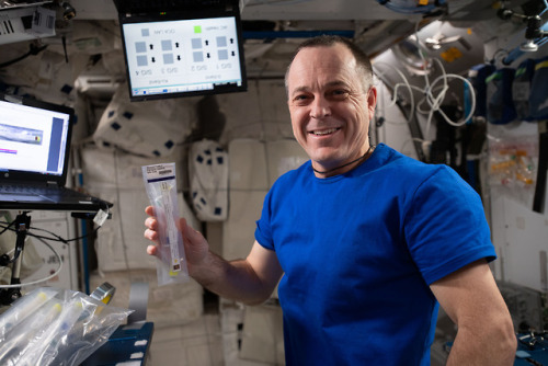 Astronaut Ricky Arnold Works With a Student-Designed Experiment...