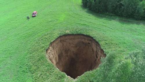 images4images:Sinkhole near Neledino in Russia, July...