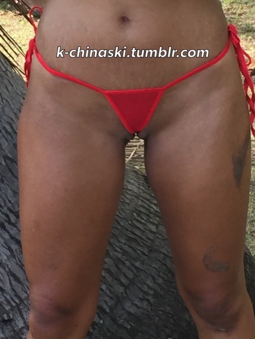 k-chinaski:Exhibitionist wife with her red sheer microbikini....