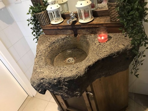 humoristics:This bathroom sink is made from igneous rock from...