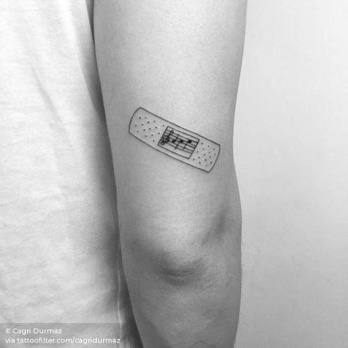 By Cagri Durmaz, done in Istanbul. http://ttoo.co/p/35503 bandage;cagridurmaz;facebook;fine line;illustrative;line art;medicine;music staff;music;profession;small;tricep;twitter