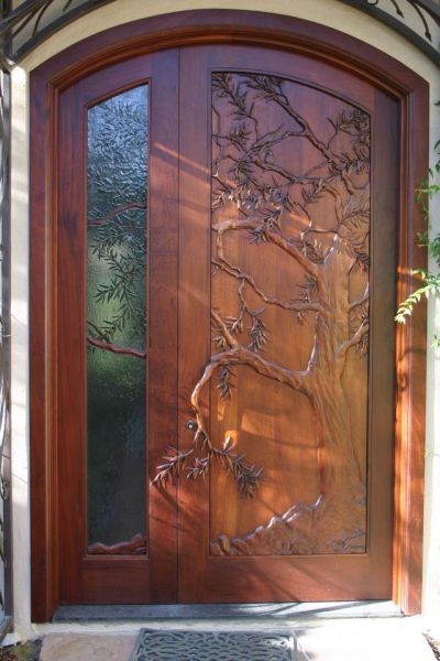 Hand carved door, olive tree carved in wood and theme continued in art glass side panel Interior Design Home