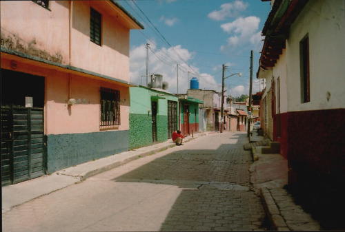 sad in red: the quiet of the street matched the stillness of...