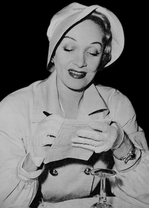 margotfonteyns:Marlene Dietrich signing her autograph for a fan,...