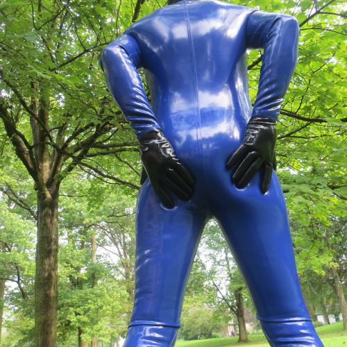 Hands on a heavy rubber butt. Inside a .90mm Blackstyle catsuit.