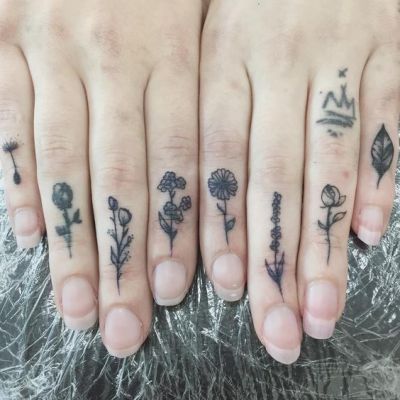 flower tattoo on finger