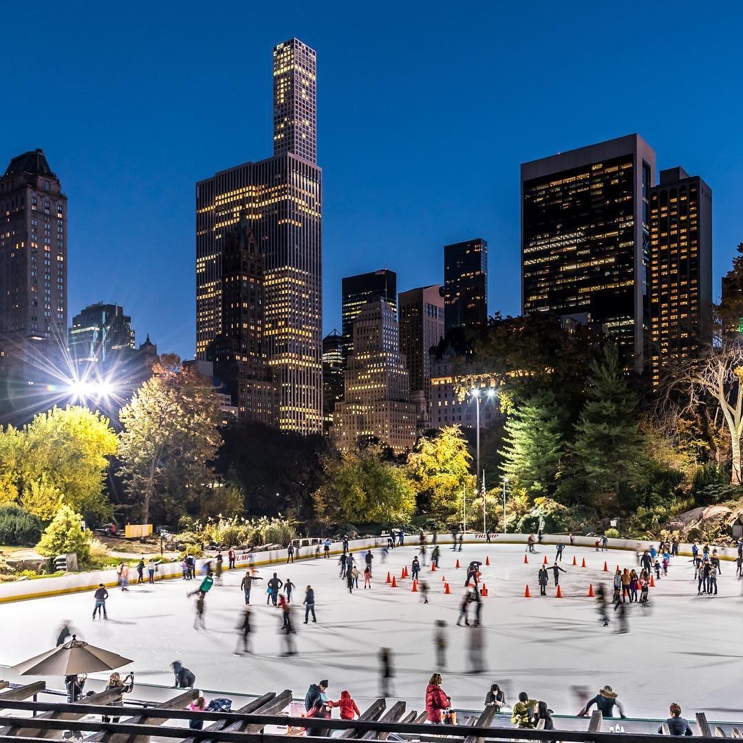Ice skating season, Central Park’s Wollman Rink and midtown skyscrapers ...