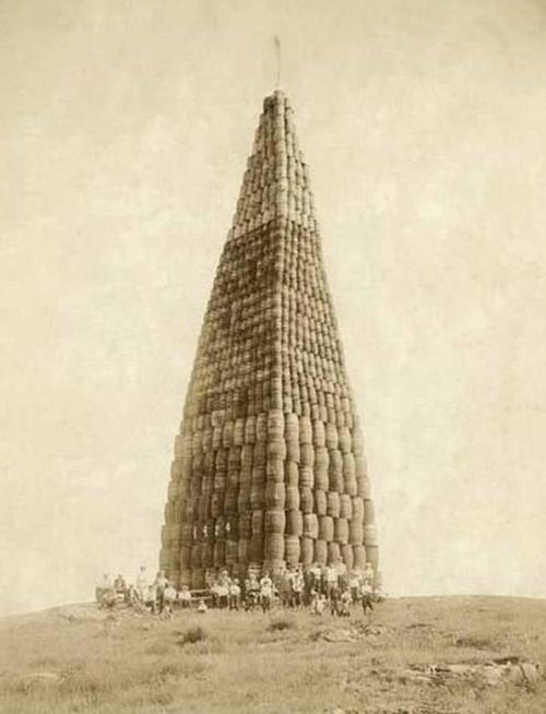 A tower of confiscated barrels full of alcohol, ready to be burned during prohibition (1924) [597 x 781] Check this blog!