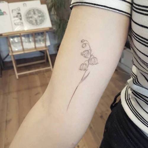 Oneline lily of the valley tattoo located on the