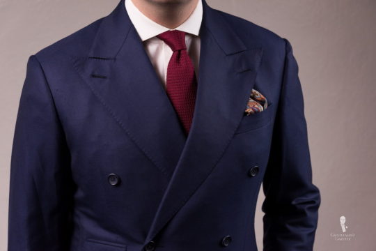 Navy suit with burgundy grenadine tie