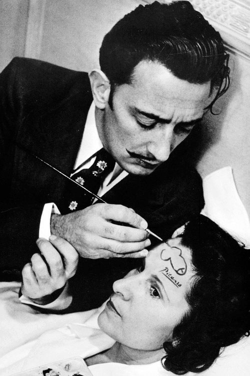 iosonorockmaballoiltango:
“Salvador Dali drawing a penis on the forehead of a woman and signing it with Picasso’s signature
”