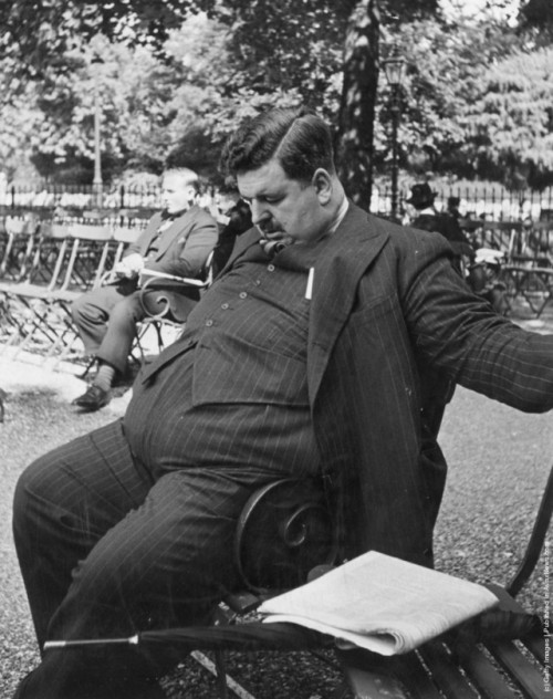 thehistoryofheaviness:An overweight man in a three-piece suit...